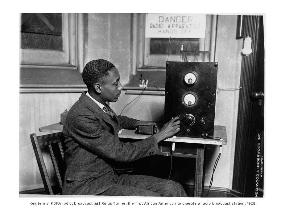 African American man operating early radio equipment in 1926.