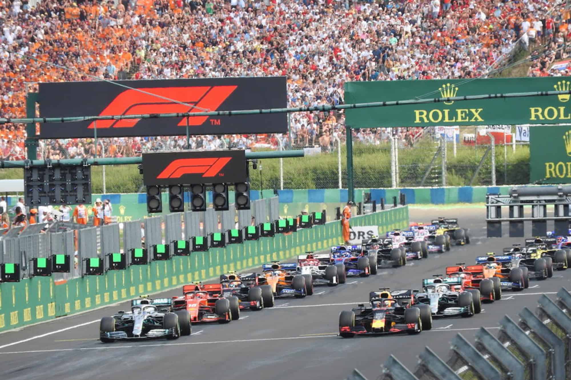 Formula 1 Hungarian Grand Prix race start with multiple F1 cars lined up on track at Budapest circui