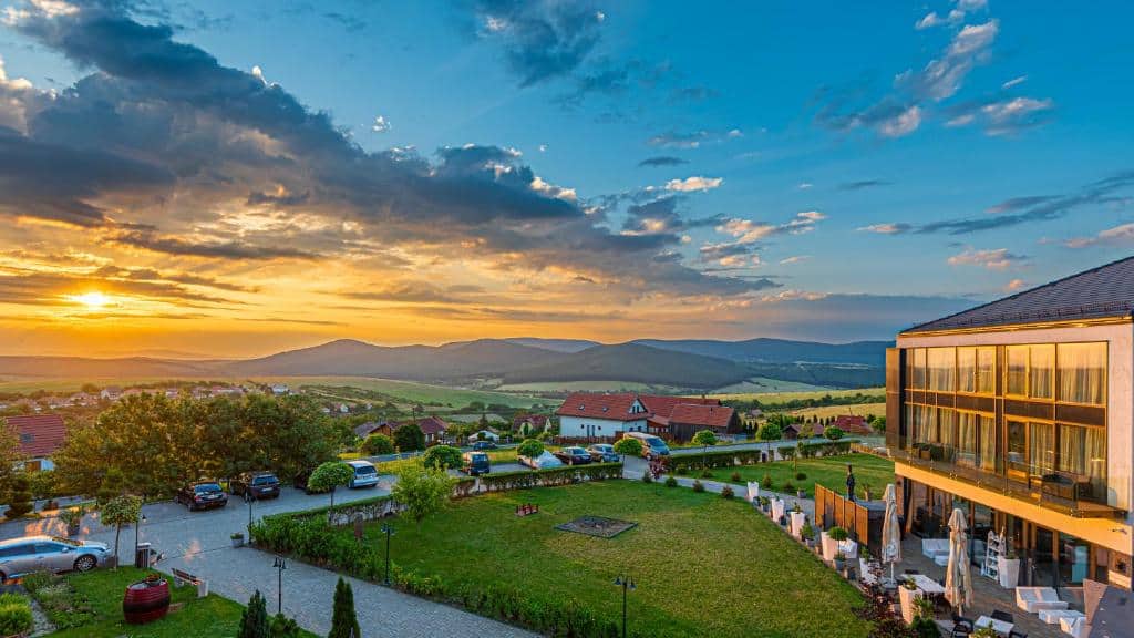 Sunset view of Hungarian countryside village with modern building - Budapest private airport transfe