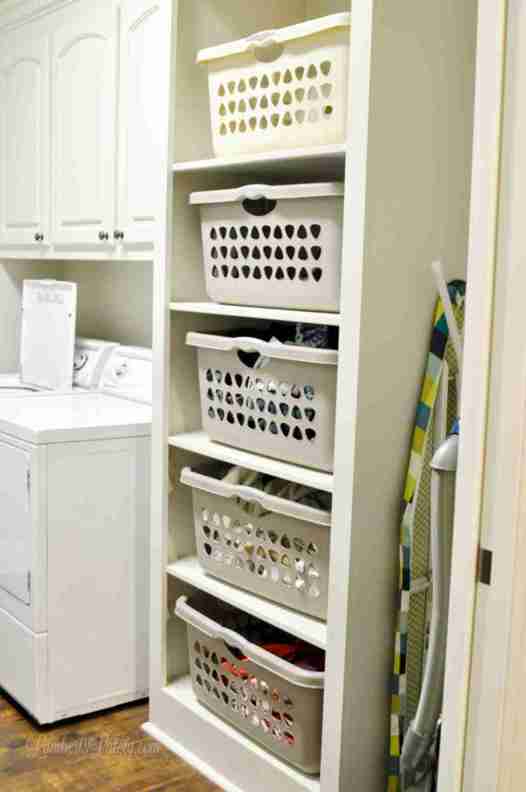 laundry baskets stacked in a cabinet.