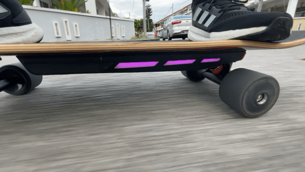 Riding photo of Exway Ripple side profile with lights