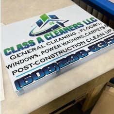 Image of a trailer dealership sign for Glass & Cleaners LLC showcasing various cleaning service trailers at I39 Supply.