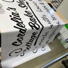 Safety construction sign at I39 Supply trailer dealership emphasizing caution and safety procedures for workers and visitors.