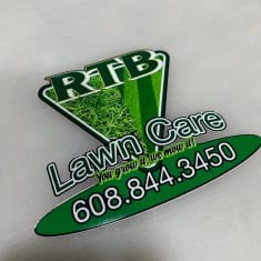 Custom lawn care trailer sign featuring RTB Lawn Care branding with contact number 608.844.3450, ideal for promoting landscaping services and trailer dealership visibility.