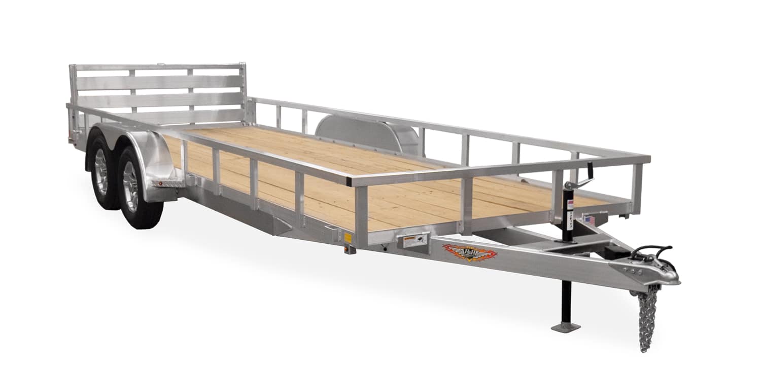 Heavy-duty flatbed trailer with dual axles and wooden deck, ideal for transporting equipment and goods. Perfect for commercial and personal use at I39 Supply trailer dealership.