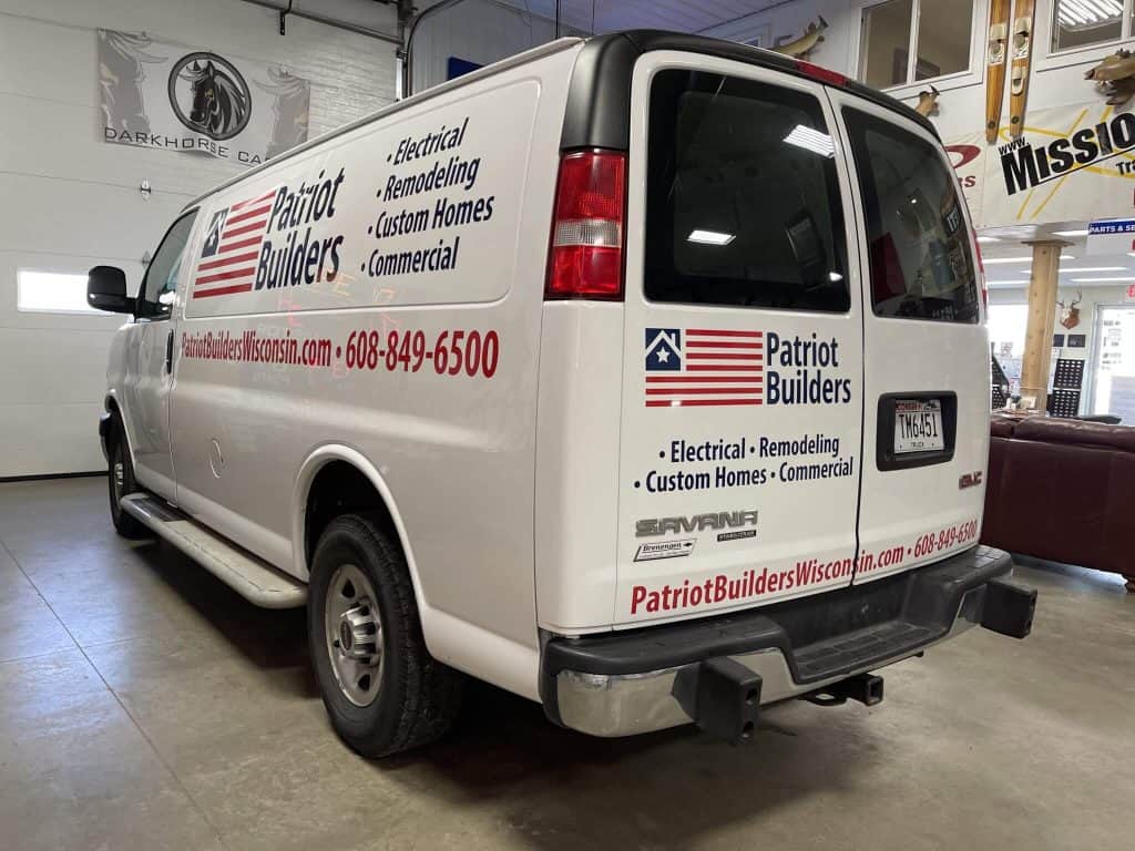 White Patriot Builders van showcasing electrical, remodeling, and custom home services at I39 Supply Trailer Dealership.
