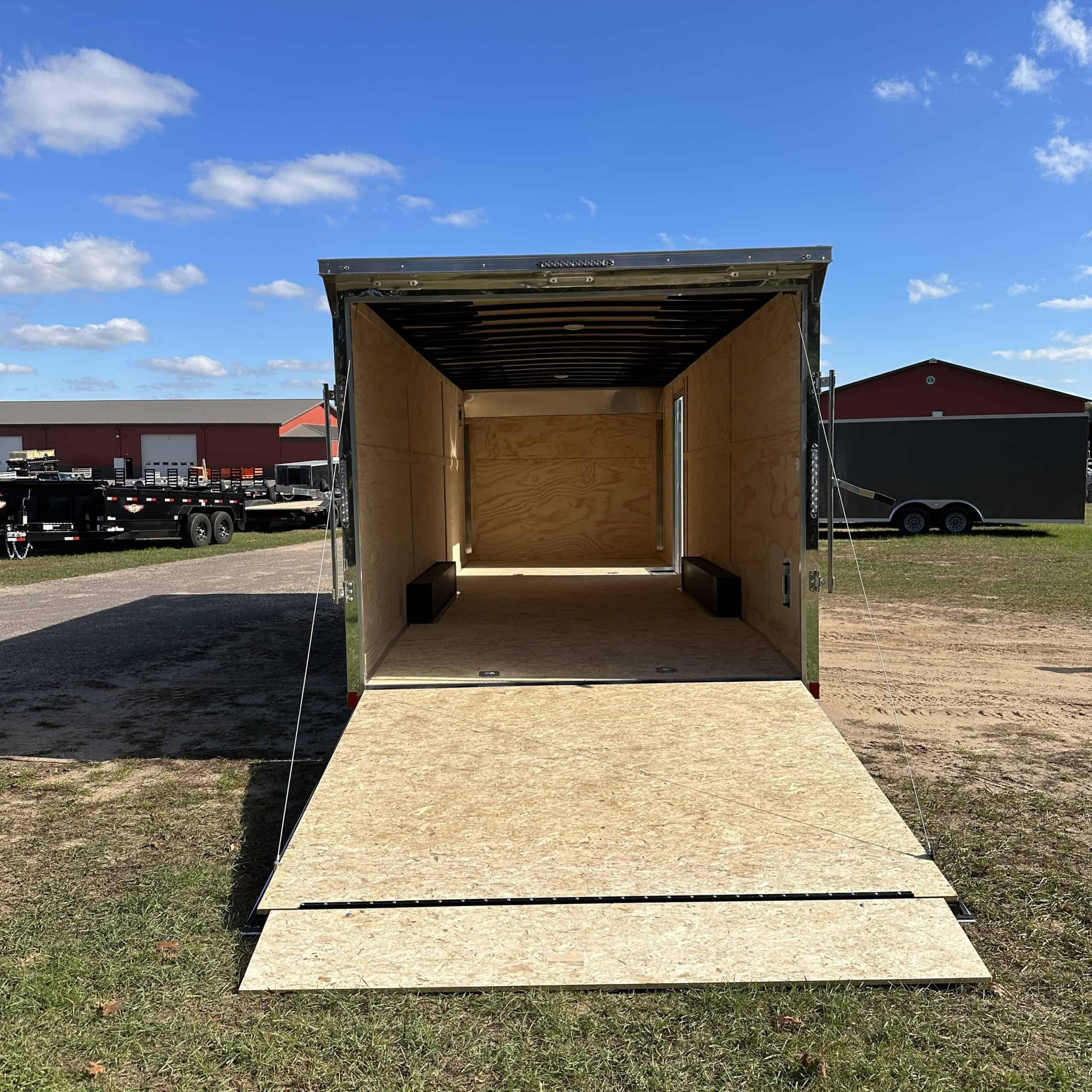 High-capacity tandem axle cargo trailer with ramp door for easy loading and unloading. Perfect for transporting equipment, tools, or personal belongings with durability and security.