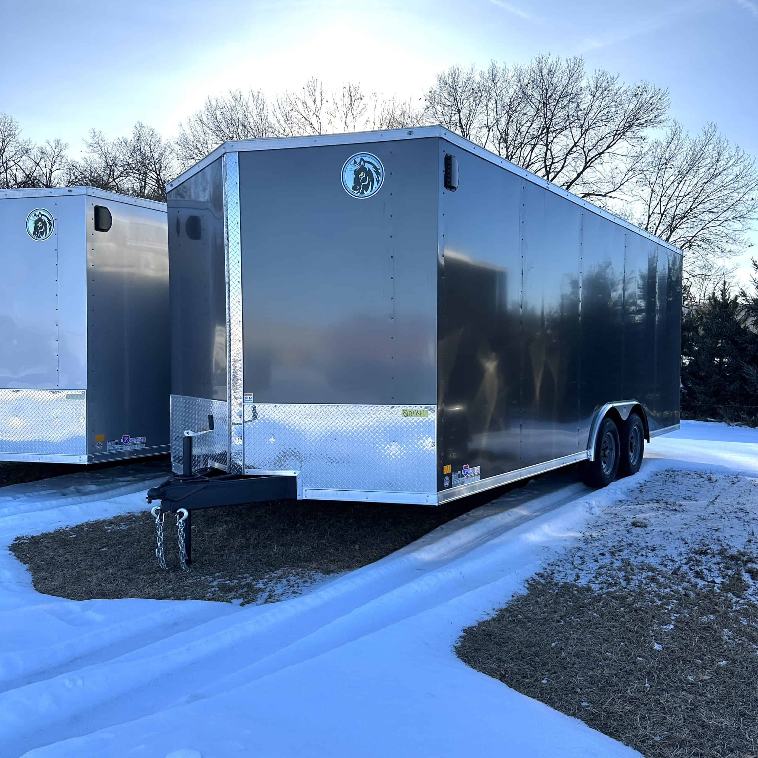 Heavy-duty 8.5' x 24' cargo trailer with tandem axles, ideal for commercial and personal hauling needs. Features durable construction, secure lock system, and versatile storage capacity.