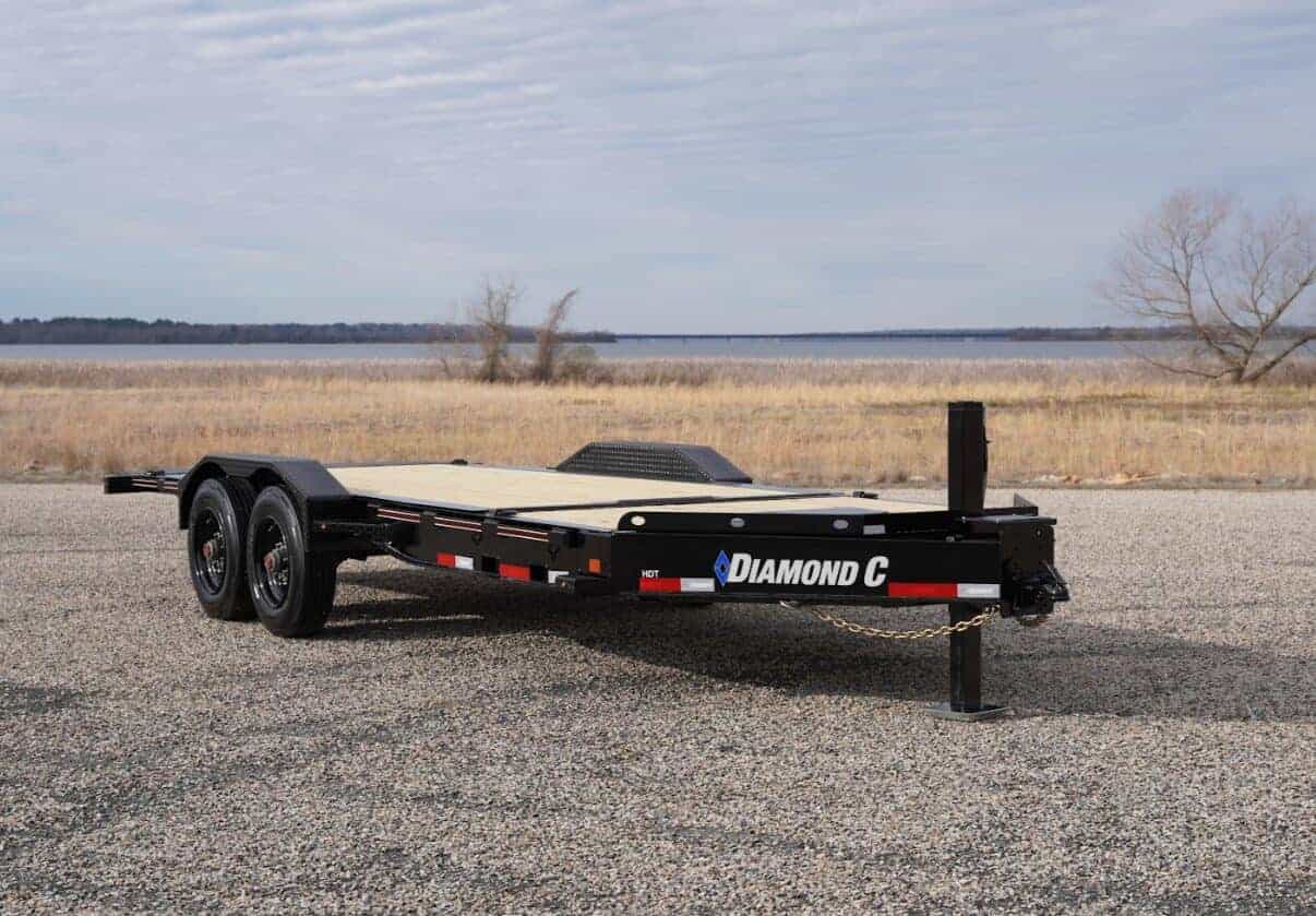 Tilt Bed Diamond C HDT Trailer for versatile hauling and easy loading, featuring a durable steel frame and tilt bed design for efficient transportation of heavy equipment.