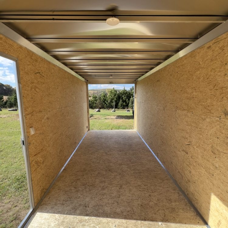 Interior view of a clean, empty trailer storage unit at I39 Supply Trailer Dealership, showcasing spacious and well-constructed trailer interiors for various storage needs.