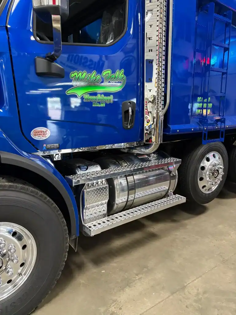 Blue semi-truck with Malibu Valley logo, showcasing a durable cargo trailer at I39 Supply.