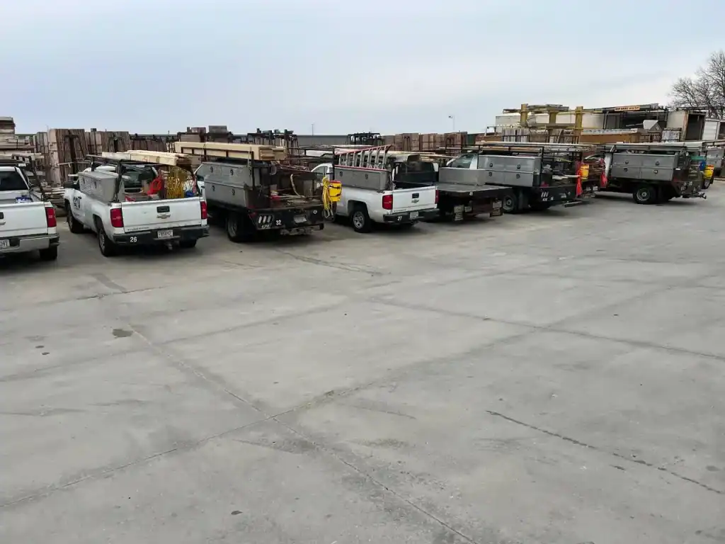 Wide view of various utility and flatbed trailers at I39 Supply trailer dealership, showcasing a range of models available for sale.