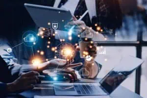 Business professionals analyzing IT systems with cloud and data icons for digital transformation.