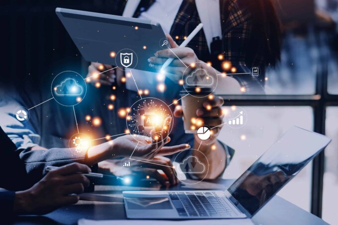 Business professionals analyzing IT systems with cloud and data icons for digital transformation.