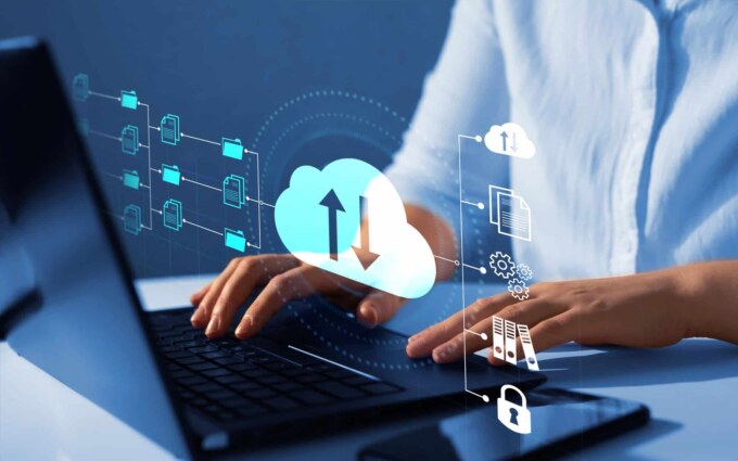 Cloud data management and migration icons with a person using a laptop.