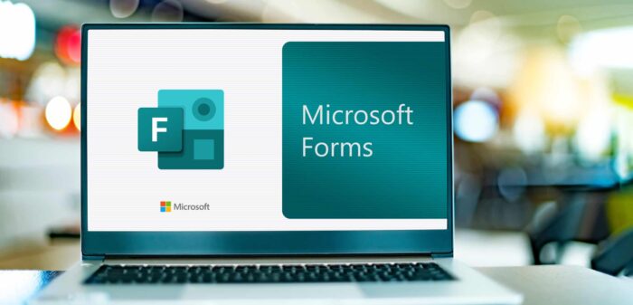 Laptop displaying Microsoft Forms logo for online surveys and data collection.