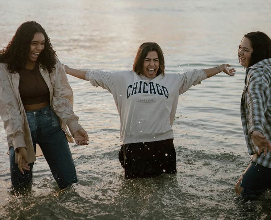 Family in water posing for picture