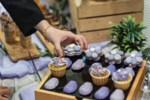 cupcake with lilac purple custom frosting and shell choclate decoration dessert by idocatering