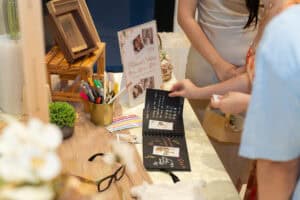 Creative polaroid and leave a message station for bride and groom newlyweds at wedding catering reception event by iDoCatering