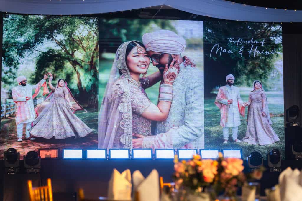 emhub wedding catering event featuring mixed race couple smiling brightly in VCR by idocatering