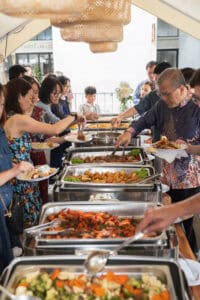 Guests enjoying wedding catering food by idocatering 