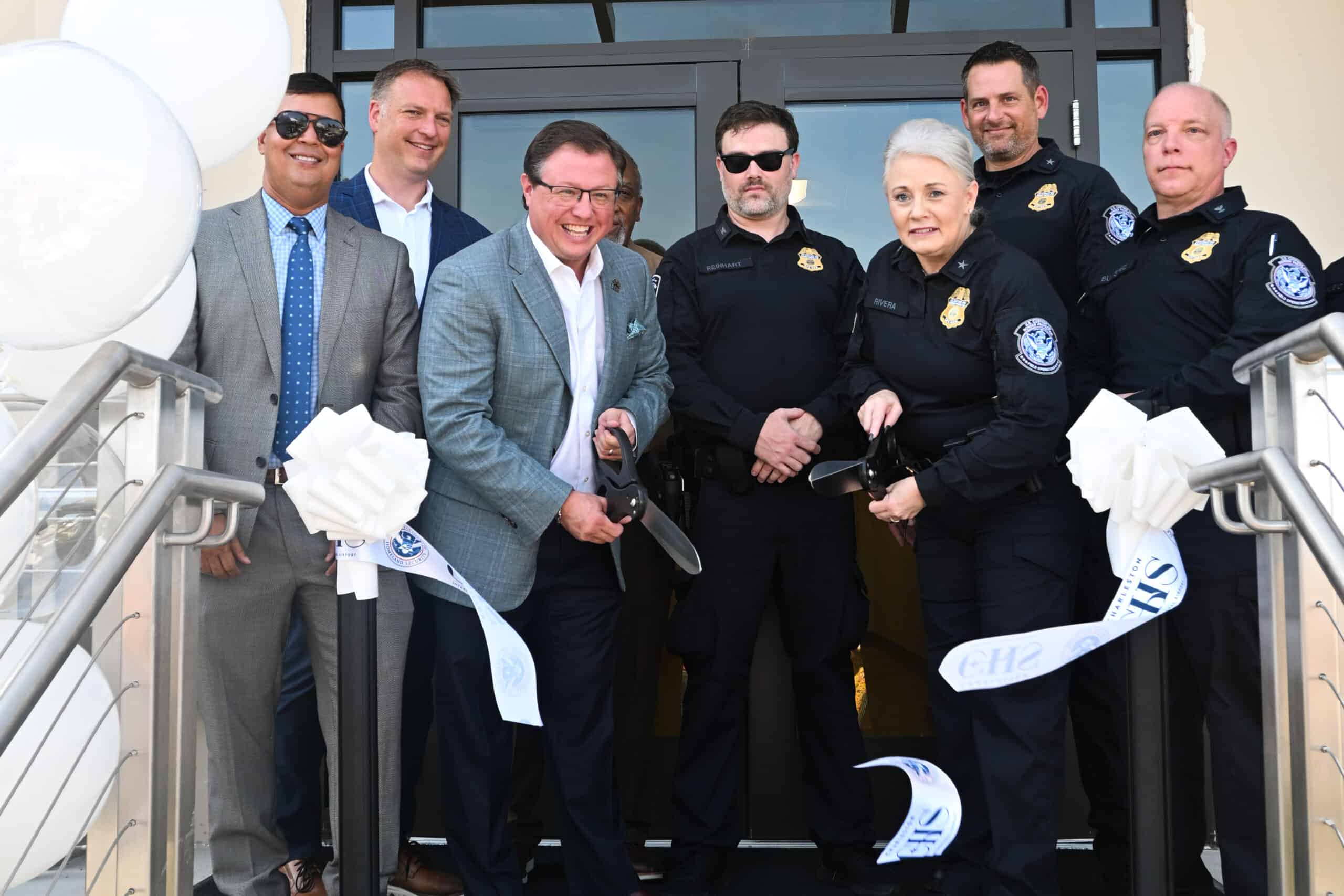 CBP and CHS officials cut ribbon at Global Entry event