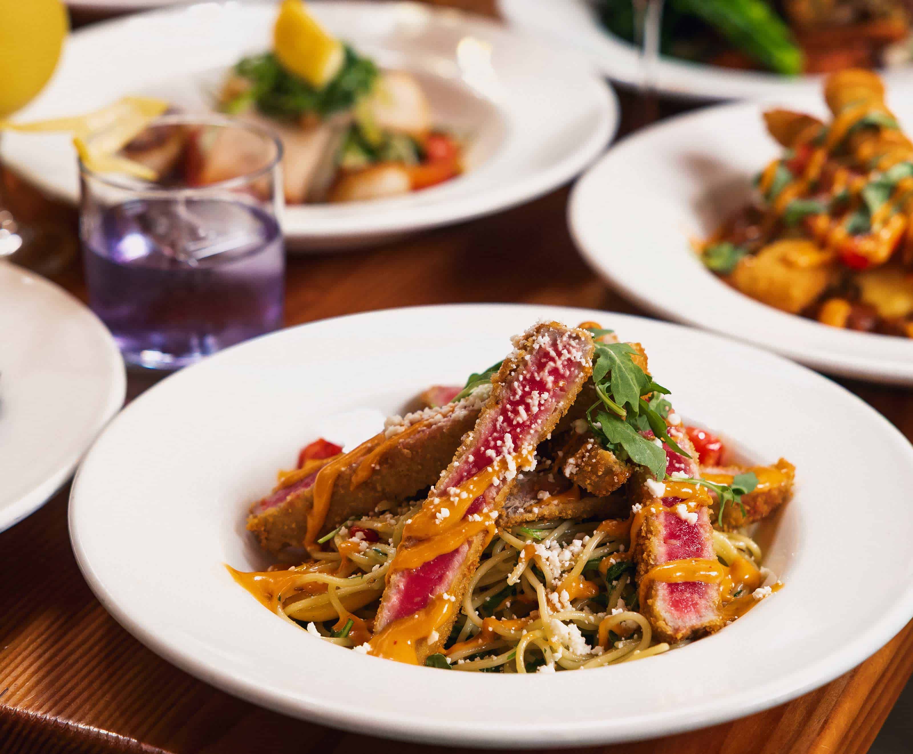 Delicious pasta dish with seared steak and fresh herbs at Il Terrazzo.