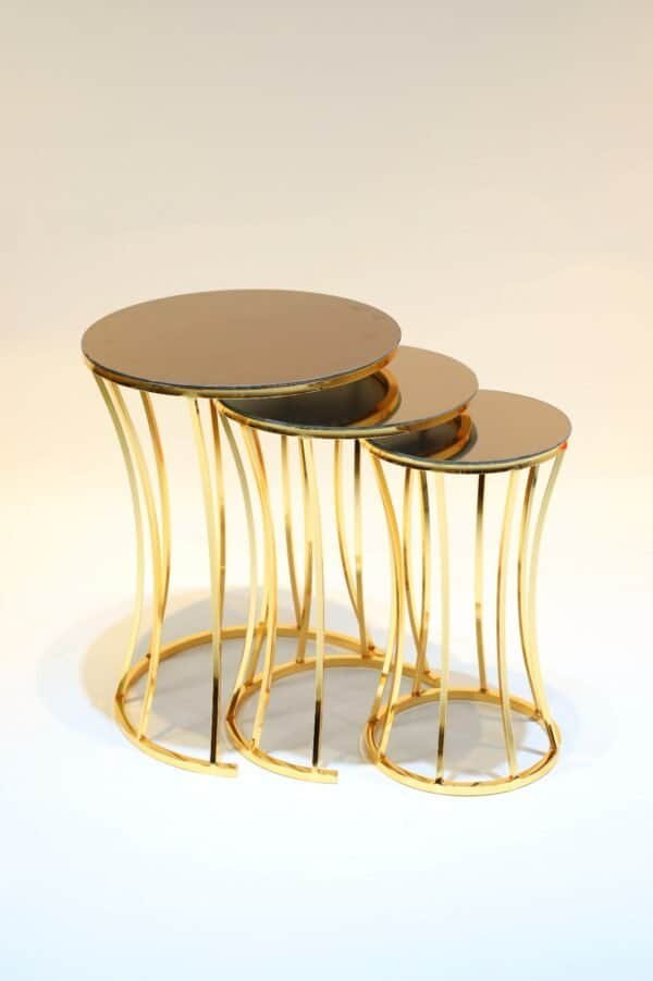 Nested Round Tables With Mirrored Tops, Gold Frames, Cascading Design, And Curved Legs.