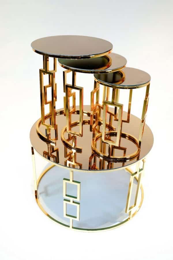 Nesting Tables With Mirrored Tops And Geometric Gold Metal Frames, Featuring Interconnected Design.