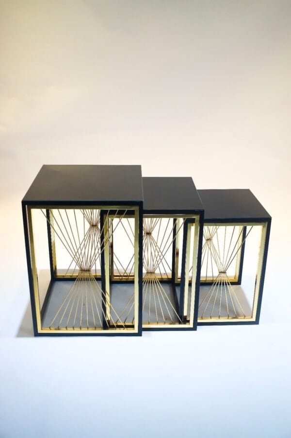 Set Of Three Nesting Tables, Black Frames, Gold Accents, Geometric Design, Graduated Sizes.