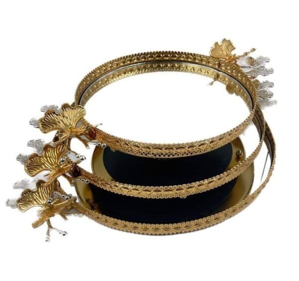 Three-Tiered Golden Tray With Intricate Patterns And Floral Embellishments, Slightly Offset Stacking.
