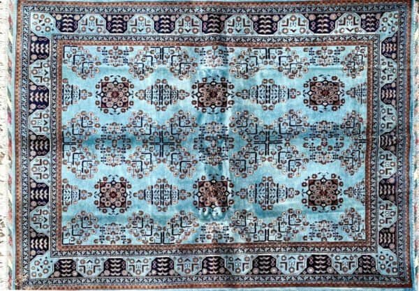 Rectangular Rug With Blue, Brown, Ivory Geometric Pattern And Detailed Decorative Border.