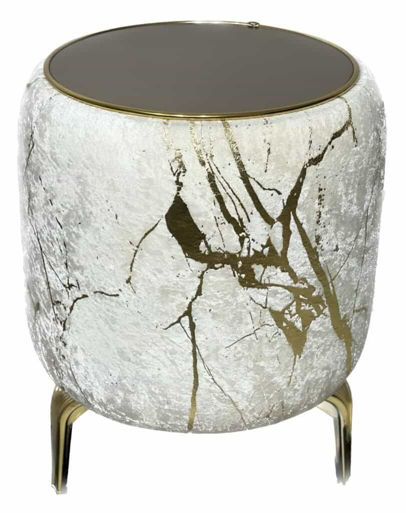 Velvet Puff Tables - The Hero Your New Zealand Home Decor Needs 4 Cylindrical Side Table With Textured White Surface, Gold Veins, Dark Top, And Gold Legs.