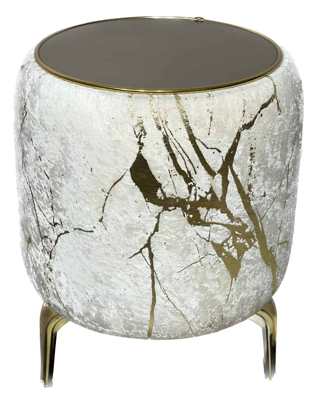 Cylindrical Side Table With Textured White Surface, Gold Veins, Dark Top, And Gold Legs.