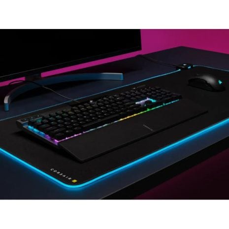 RGB gaming keyboard with mechanical keys and LED backlighting on a tech desk setup in a dark room for immersive gaming experience, ideal for gaming and tech enthusiasts.