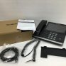 Yealink IP phone with accessories and packaging for business communication.
