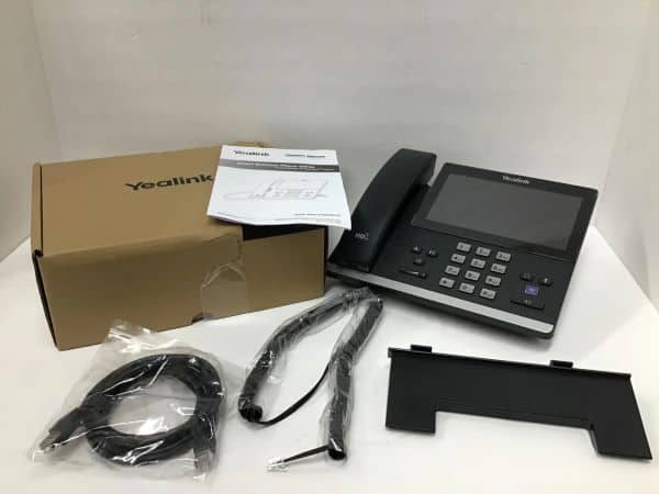 Yealink IP phone with accessories and packaging for business communication.