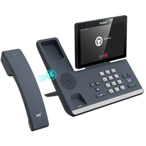 Bluetooth VoIP office phone system with touchscreen display and wireless handset for seamless communication.