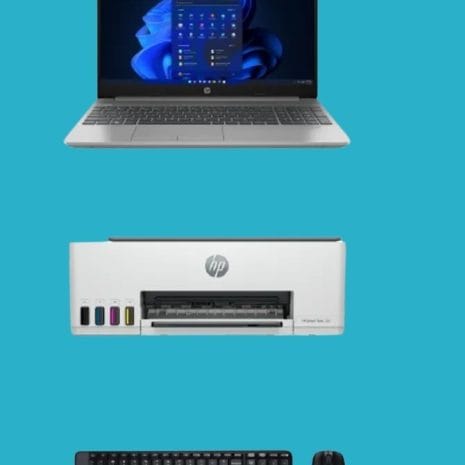 Laptop computer with Windows interface, HP printer, keyboard and mouse for office or home productivity setup, modern technology essentials for seamless work and printing.