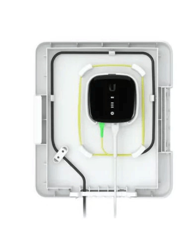 Fast charging electric vehicle wall charger with sleek black design, mounted on a white wall, showcasing modern EV charging technology for sustainable transport solutions.