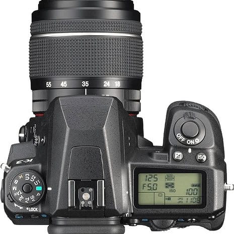 Canon DSLR camera with zoom lens for professional photography and videography. Perfect for capturing high-quality images in various settings.