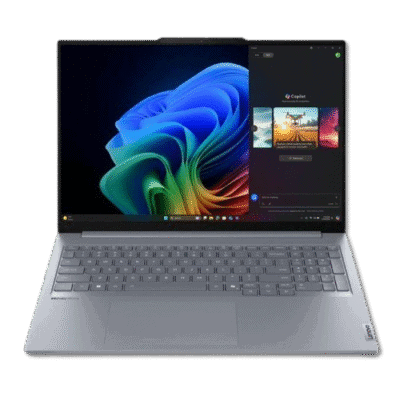 Laptop displaying Windows desktop with colorful wallpaper and chat application, modern tech device, portable computer for work or entertainment in South Africa.