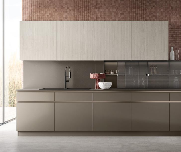 Modern kitchen with beige cabinetry, a black faucet, and a tiled backsplash.