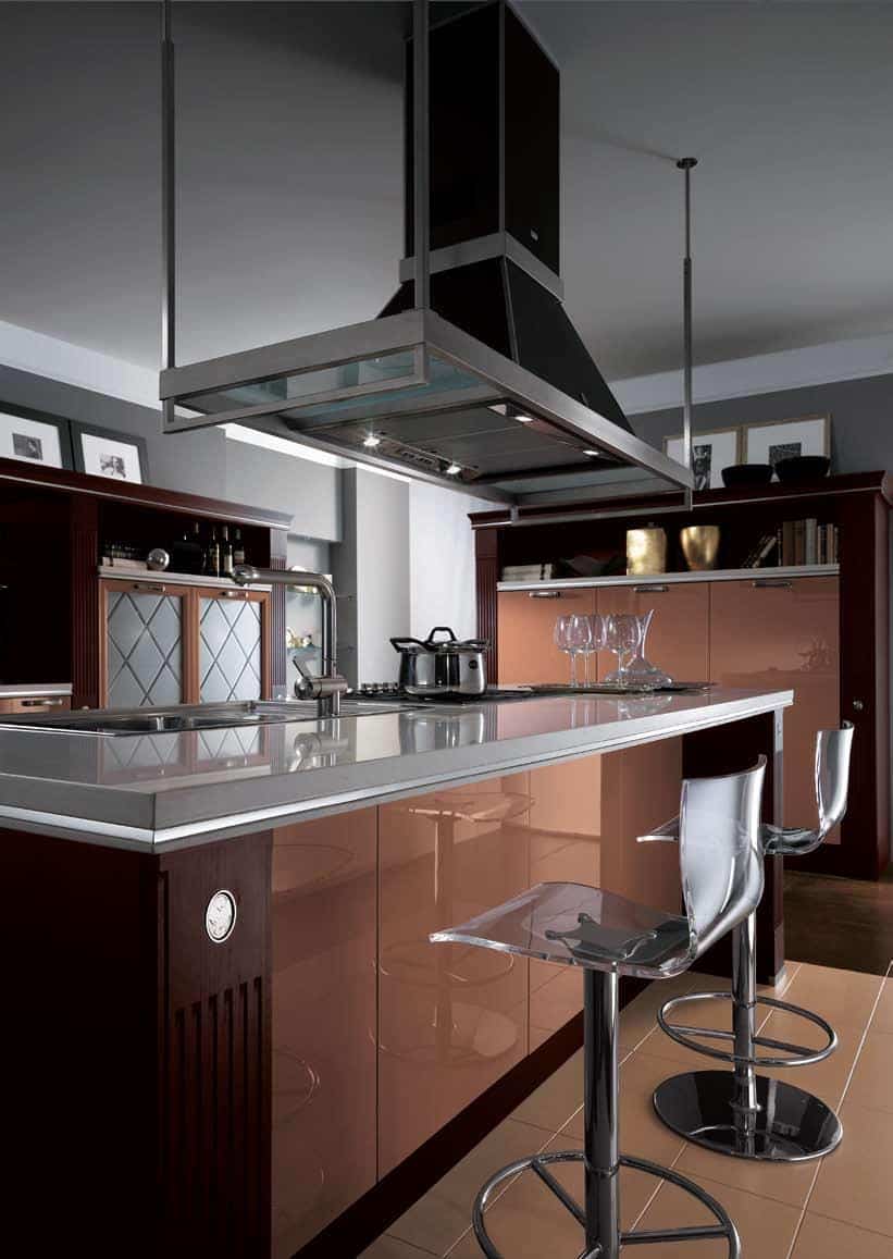 Modern kitchen with a sleek island, transparent barstools, stainless steel appliances, and a contemporary range hood.