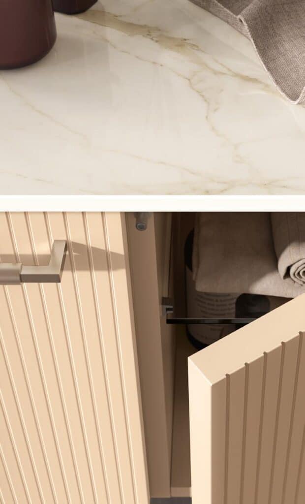 A beige cabinet door slightly open with visible towel storage, under a marble countertop.