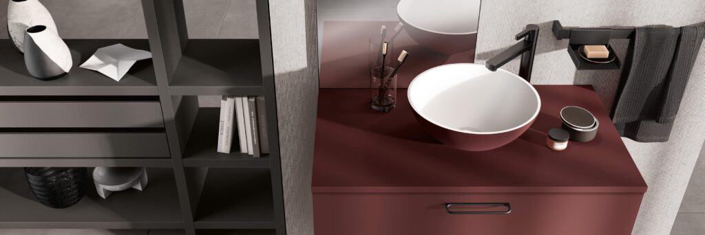 Modern bathroom counter with round sink, black faucet, and shelf displaying vases, books, and toiletries.