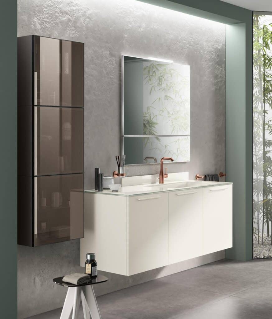 Modern bathroom with a floating vanity, sleek mirror, and minimalist design elements, featuring a black wall cabinet and bronze fixtures.