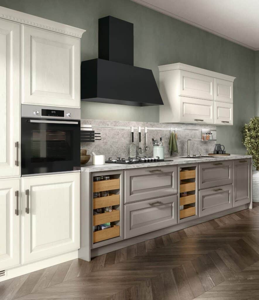 Modern kitchen with white cabinets, black range hood, marble backsplash, integrated oven, and herringbone wood flooring.