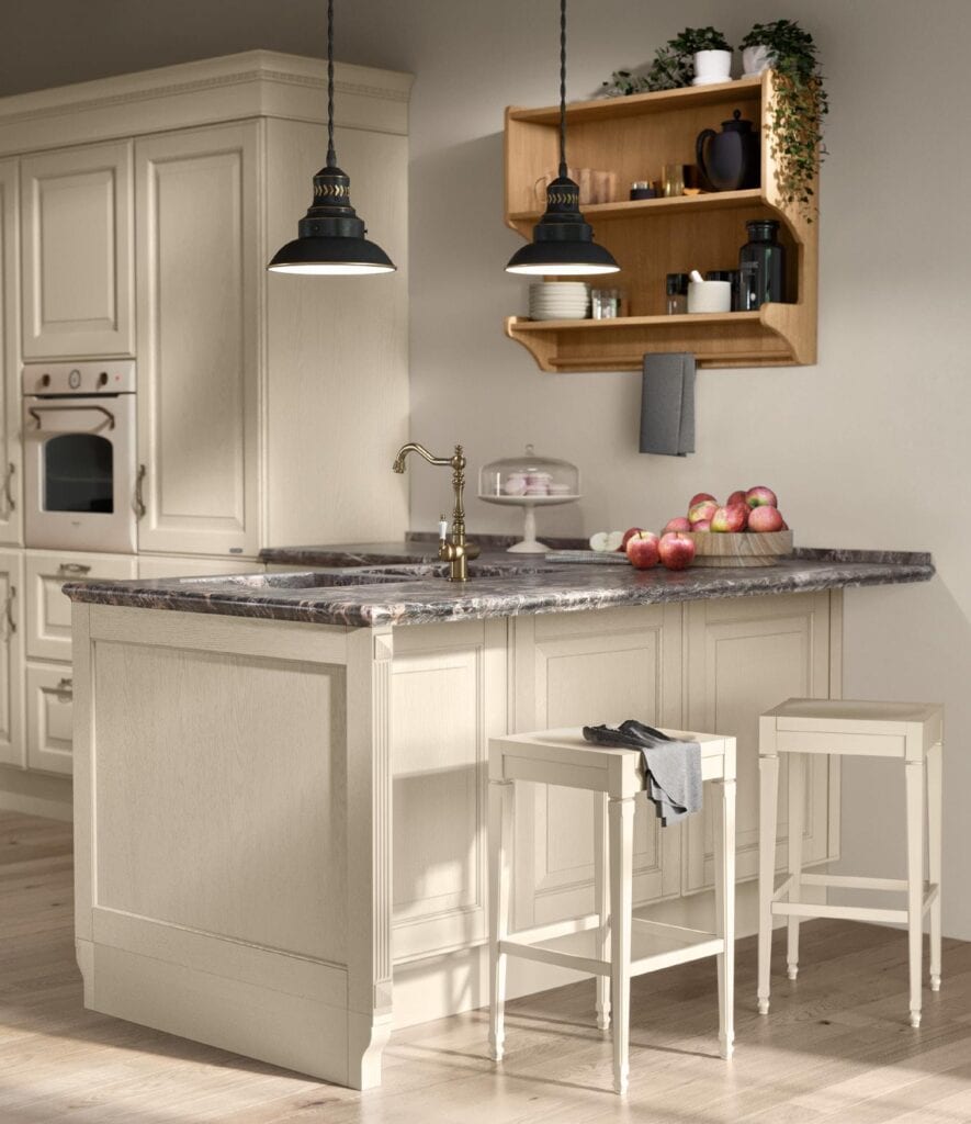 Elegant kitchen with a marble-topped island, wooden cabinetry, hanging pendant lights, and apples on the counter.