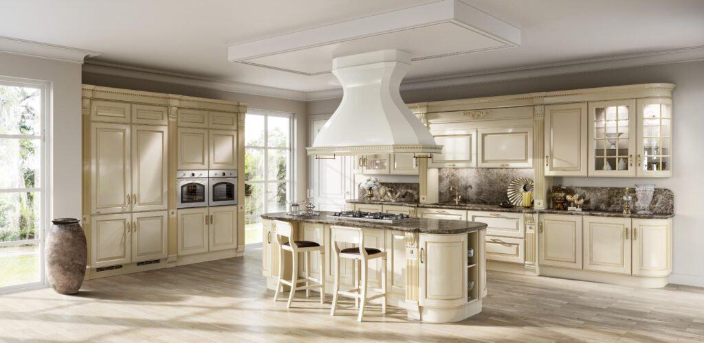 Luxurious cream-colored kitchen with ornate cabinetry, a large island with bar stools, built-in double ovens, marble countertops, and a decorative range hood.